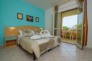 Postel nebo postele na pokoji v ubytování Agriturismo LA FATA