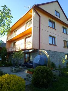 a building with a playground in front of it at Noclegi u Janika in Mizerna