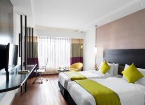 Postel nebo postele na pokoji v ubytování HYCINTH Hotels