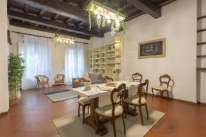 a dining room with a table and chairs at Mamo Florence - Feelgood Apartment in Florence