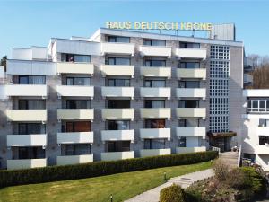 a building with a sign on top of it at Studios im Haus Deutsch Krone I Kostenloses Parken I home2share in Bad Rothenfelde +53 photos