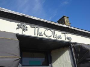 a sign on the top of a building at Black Burn Lodge B & B in Newcastleton