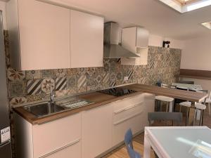 A kitchen or kitchenette at ComfortHouse Ladispoli