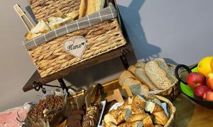 a table topped with lots of different types of bread at Sunlife Oldcity in Istanbul