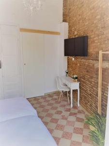 Televízia a/alebo spoločenská miestnosť v ubytovaní Casa del Azucar