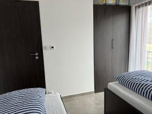 Postel nebo postele na pokoji v ubytování Apartmán D5 Nová Pec