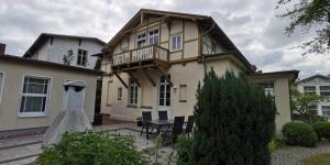a wedding dress in front of a house at Ferienwohnung in Heringsdorfer Villa Koje in Bansin