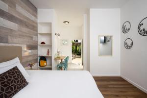 Ένα ή περισσότερα κρεβάτια σε δωμάτιο στο Kibbutz Malkiya Travel Hotel +68 φωτογραφίες