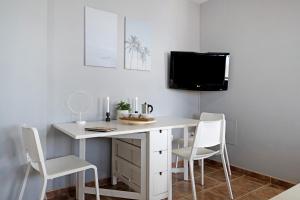 Telewizja i/lub zestaw kina domowego w obiekcie Apartamento La Estrella ii
