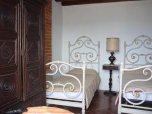 Tempat tidur dalam kamar di Villa Il Leccio