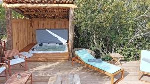 a patio with a gazebo with a hot tub at Bergeries de charme Caselle di Conca in Conca