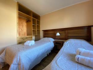 Posteľ alebo postele v izbe v ubytovaní Patagonia Austral Suites