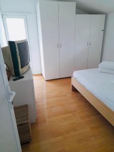 Postel nebo postele na pokoji v ubytování Vila Minerva