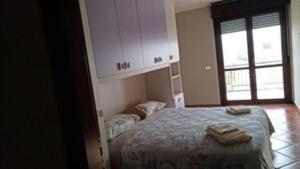 Postel nebo postele na pokoji v ubytování B&B Le terrazze di Pompea