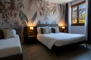 Säng eller sängar i ett rum på Hotel Ulivi
