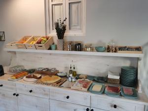 a table with food on it with plates and bottles of wine at Hotel Rural Covarrubias in Covarrubias