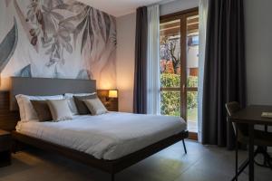 Postel nebo postele na pokoji v ubytování Hotel Ulivi