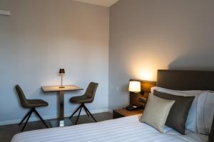 Postel nebo postele na pokoji v ubytování Hotel Ulivi