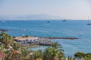 a view of a large body of water with boats at Royal Antibes - Luxury Hotel, Résidence, Beach & Spa in Antibes