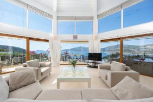 a living room with a couch and a table at Hotel Villa Mahal in Kalkan