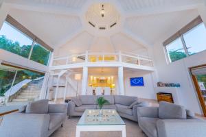 a living room with couches and a table at Hotel Villa Mahal in Kalkan