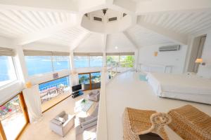 a bedroom with a bed and a living room at Hotel Villa Mahal in Kalkan
