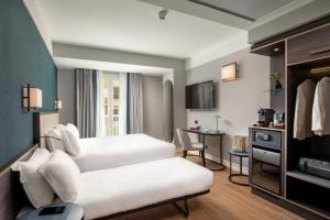 Kuchyň nebo kuchyňský kout v ubytování Hotel St Martin by OMNIA hotels