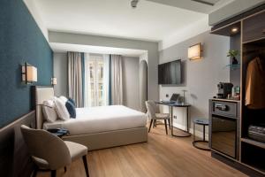 TV a/nebo společenská místnost v ubytování Hotel St Martin by OMNIA hotels