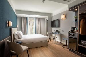 Postel nebo postele na pokoji v ubytování Hotel St Martin by OMNIA hotels