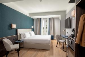 Postel nebo postele na pokoji v ubytování Hotel St Martin by OMNIA hotels