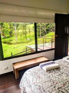 Postel nebo postele na pokoji v ubytování Condominio Hacienda Shangrila