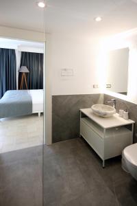 Postel nebo postele na pokoji v ubytování Arnna Hotel