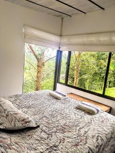 Postel nebo postele na pokoji v ubytování Condominio Hacienda Shangrila