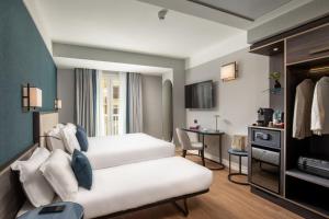 Postel nebo postele na pokoji v ubytování Hotel St Martin by OMNIA hotels