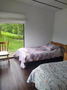 Postel nebo postele na pokoji v ubytování Condominio Hacienda Shangrila