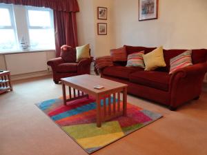 a living room with a couch and a coffee table at The Garden Flat in Hunstanton
