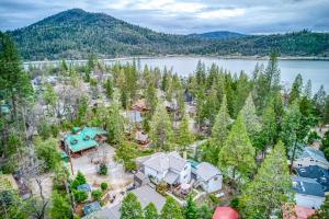 an aerial view of a home with a lake at Black Bear Cabin in Bass Lake