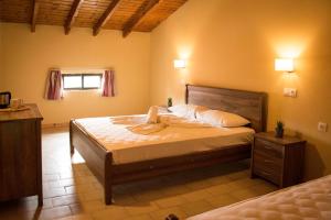 Postel nebo postele na pokoji v ubytování Koulouris Beach Hotel