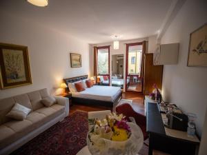 A bed or beds in a room at Ego' Residence Ferrara