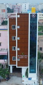 a building with a sign on the side of it at R Square Guest inn in Nellore