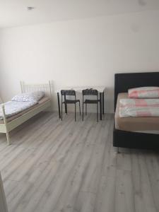 Cama o camas de una habitación en Pension Rückert