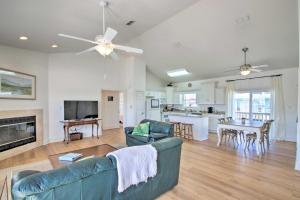 a living room with a couch and a fireplace at Pensacola Beach Home 1 Block to Beach Access in Pensacola Beach
