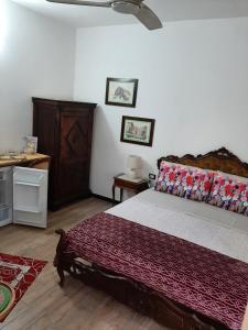 Postel nebo postele na pokoji v ubytování Retro' BeB + 10 fotografií