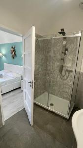 a bathroom with a shower and a bed in a room at B&B Doralice in Catania +105 photos