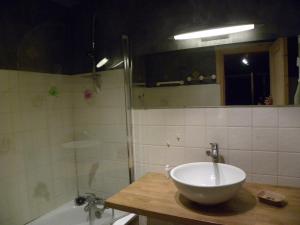 a bathroom with a bowl sink and a shower at LA CORDEE in Valloire