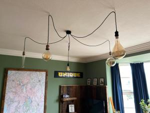 a group of lights hanging from a ceiling at Silver Howe, Bowness-on-Windermere in Bowness-on-Windermere