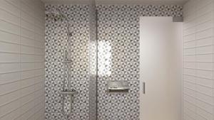 a shower in a bathroom with white tiles at Elafonisi Resort by Kalomirakis Family in Elafonisi