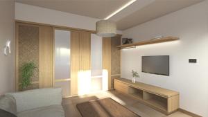 a living room with a couch and a tv on a wall at Elafonisi Resort by Kalomirakis Family in Elafonisi