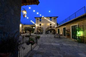 a courtyard of a building with christmas lights at Masseria del Carmine Maggiore 1817 in Pozzuoli