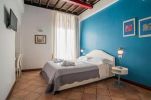 Ένα ή περισσότερα κρεβάτια σε δωμάτιο στο SWEETSUITE Rome